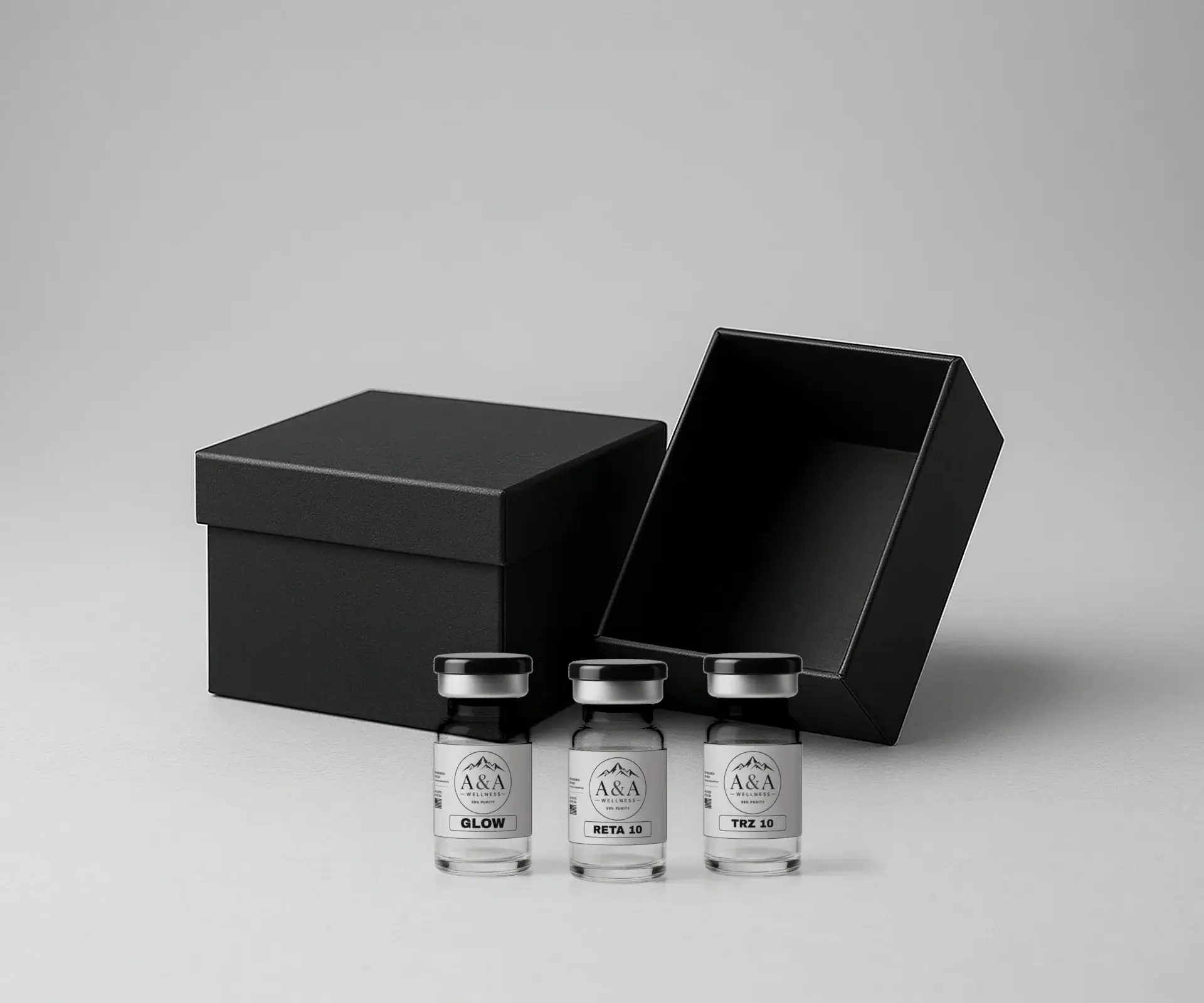 A&A Wellness vials and packaging arranged in a minimal black and white studio