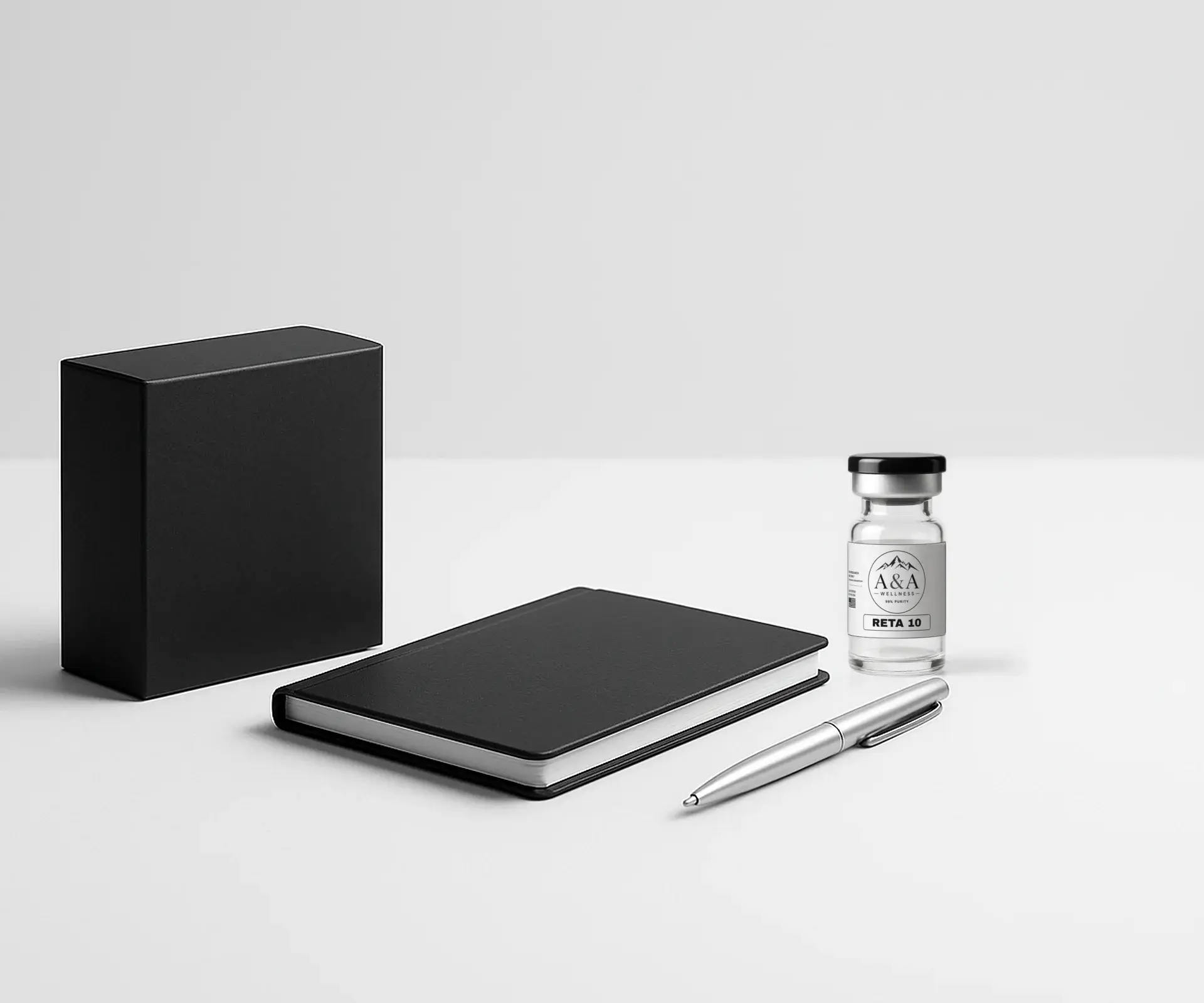 Minimal desk with a plain black packaging box, notebook, pen and an A&A Wellness research vial