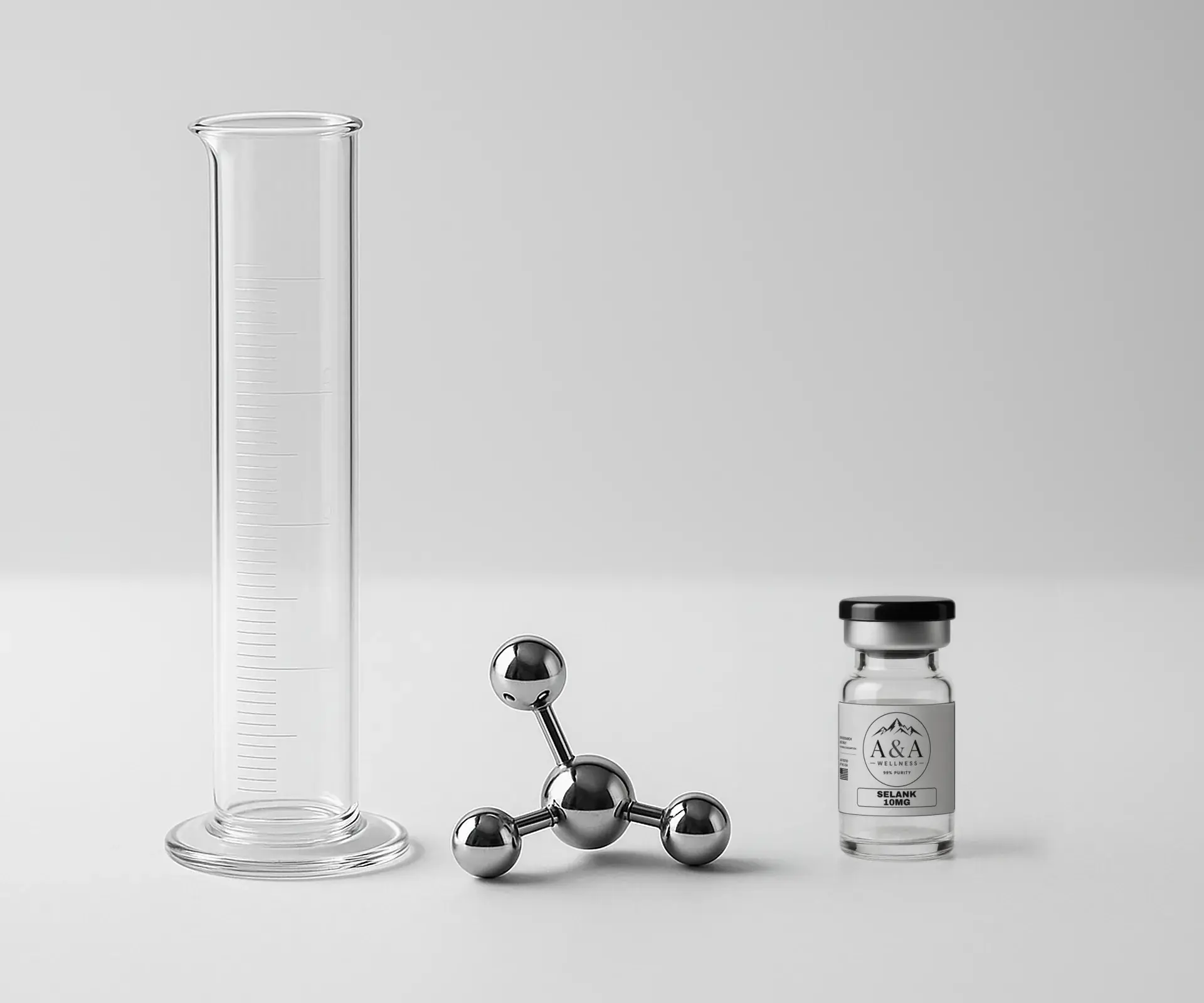 Glass graduated cylinder, a chrome molecule model and an A&A Wellness Selank research vial on a white bench