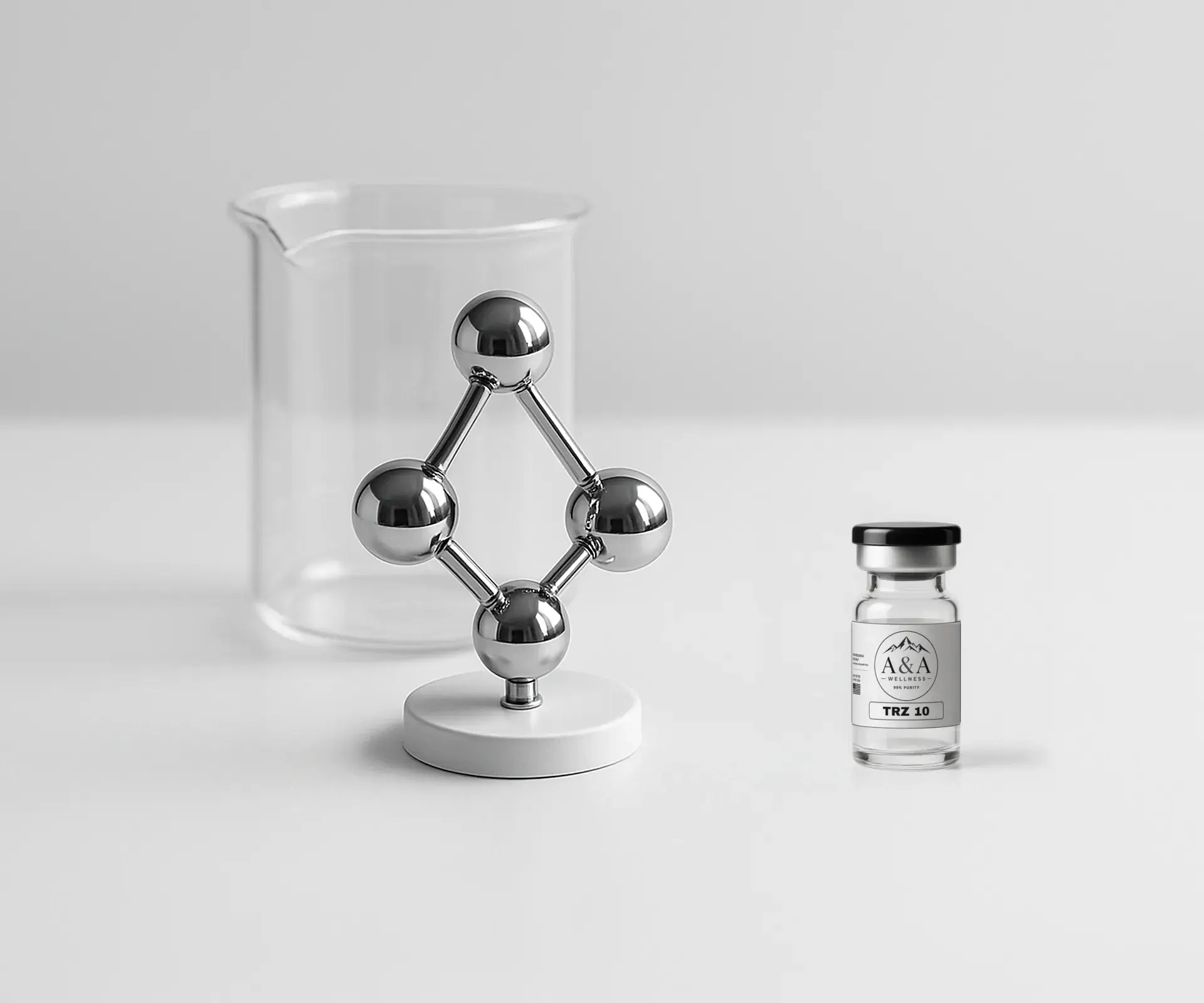 Chrome molecule model on a white pedestal, a glass beaker and an A&A Wellness TRZ 10 research vial